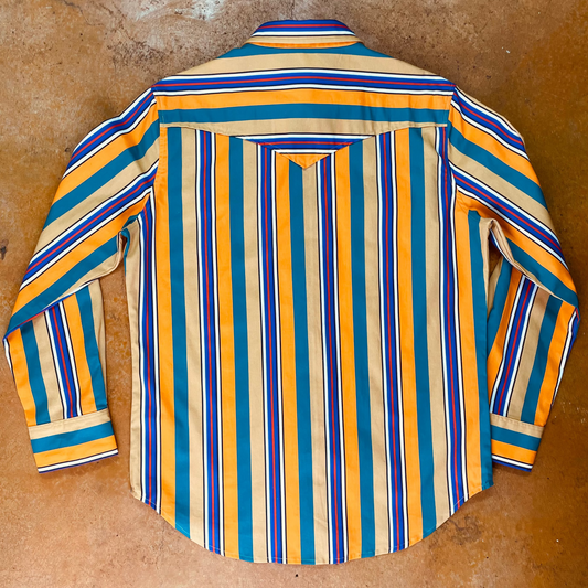 Striped shirt with blue, orange, and green pattern on a brown surface