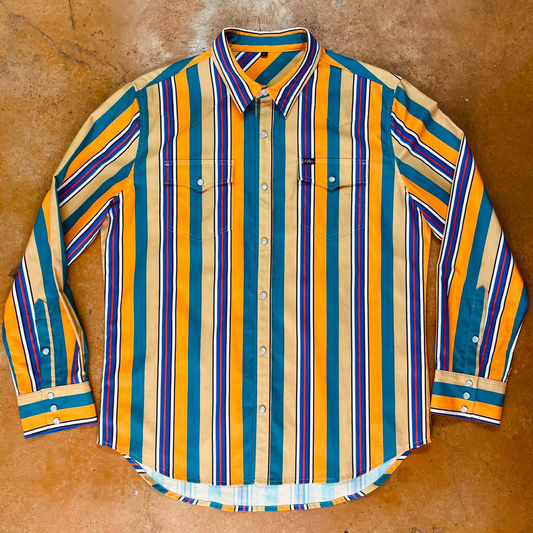 Striped shirt with orange, blue, and green pattern on a brown surface